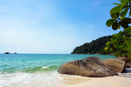 beautiful seascape. blue sea of yellow beach and large rocks on Pangkor island, Malaysiaの写真素材