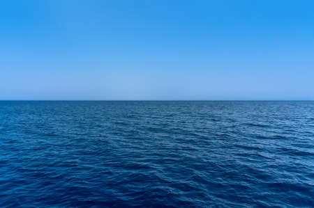 the Blue sea water surface on skyの写真素材