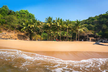 Paradise beach in Gokarna, India. Beautiful deserted landscape with clean sand and wave. View from the sea to the shore.の写真素材