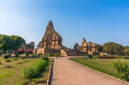 Beautiful image of Kandariya Mahadeva temple, Khajuraho, Madhyapradesh, India with blue sky clouds in the background, worldwide famous ancient temples in India, UNESCO world heritage site.の写真素材
