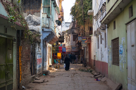 Seller sells vegetables and fruit from carts in the narrow streets of the ancient Indian city of Varanasiのeditorial素材