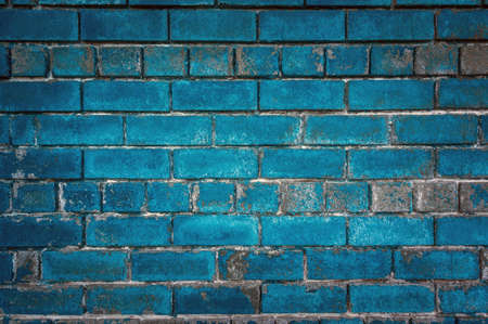 The green background of the old bricks. Painted green wall in grunge style or loft style.の写真素材