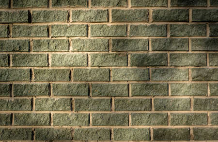 Background of brick wall dark green color. Smooth brick walls.の写真素材
