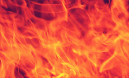 Firestorm texture. Bokeh lights on black background, shot of flying fire sparks in the airの写真素材