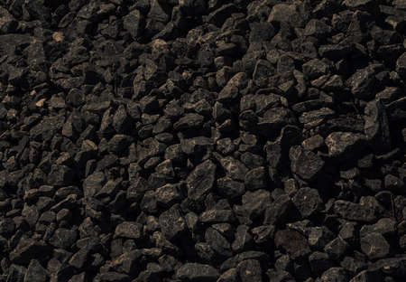 black background of dark stone. The texture is not smooth black stone.