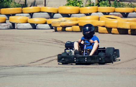 young boy raced on sport kart. get the map drifting on kart trackの写真素材