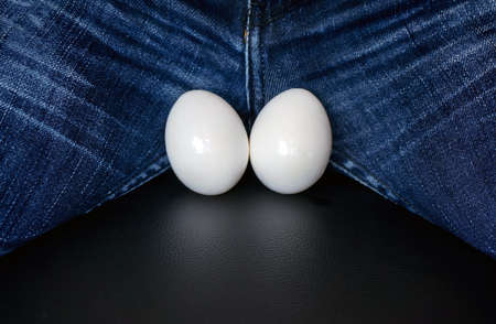 men's testicles in the form of two white eggs with copy space for the textの写真素材