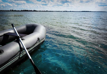 Inflatable boat with a motor on a beautiful picturesque lake. the boat left right copy spaceの写真素材