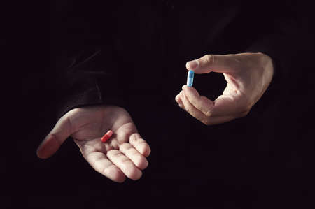 Red Pill Blue Pill concept. The right choice the concept of the movie matrix. The choice of tablets.の写真素材