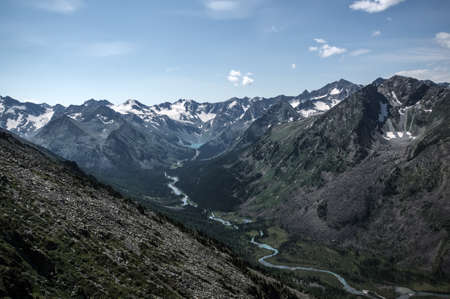 mountain range with valley, mountain lakes and river during sunset, national park in Altai republic, Siberia, Russiaの写真素材