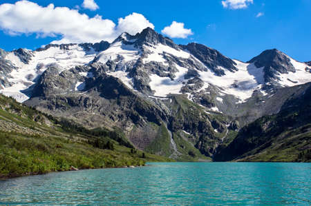 Lake in the mountains. Beautiful mountain landscape with one small mountain and a lakeの写真素材