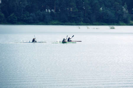 Kayaking competitions on the lake. competitions on rowing on open waterの写真素材