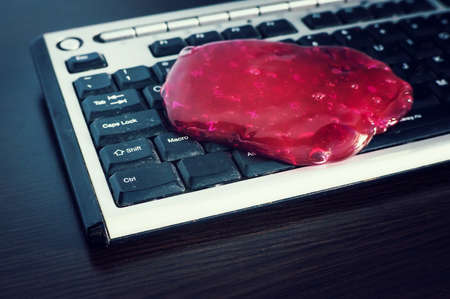 Red soft gel cleaning dust. Cleaning your computer's keyboard.の写真素材