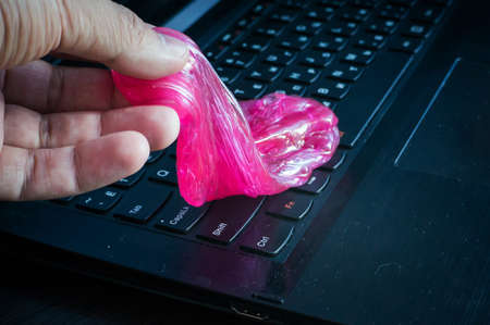 Slime is the ultimate tool to clean the keyboard from dust and dirtの写真素材