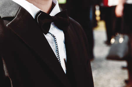 Baby boy in a tuxedo at the ceremonyの写真素材