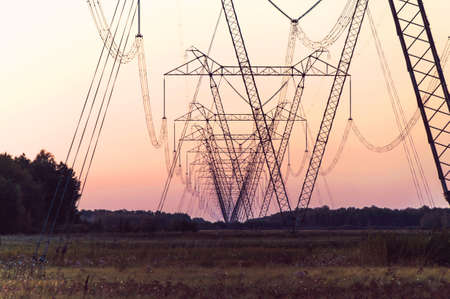 Silhouette High voltage electric tower on sunset time and sky on sunset time background.の写真素材