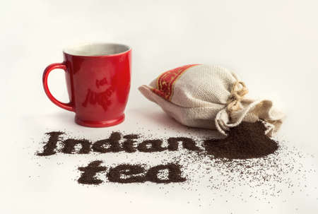 The famous Indian tea on white background Black tea in a mug in the bag and on a white table.の写真素材