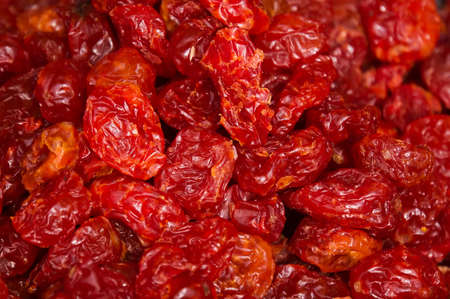 Close up of dried raspberries. Red raisins in the background.の写真素材