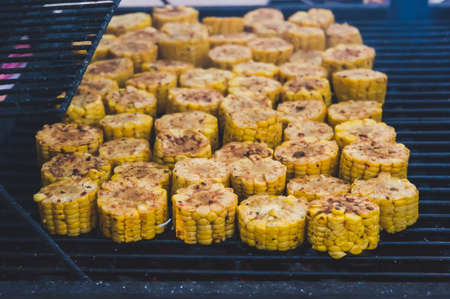Tasty grilled corns. large grill yellow corn cut into small slices.の写真素材