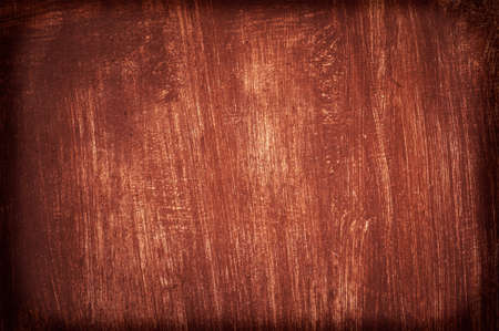 Old Damaged Wall Cracked Paint, Grunge Background, red color. The texture of the red paint on the...