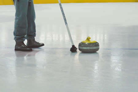 Playing a game of curling.
