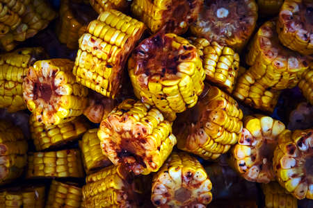 Fried corn. Grilled corn. Food background made of baked corn. The concept of healthy natural food....