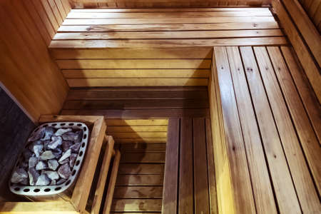 Interior of small home Finnish wooden sauna. Infrared sauna. Cedar bath. beautiful nature interior...