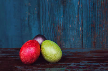 Three colorful handmade easter eggs