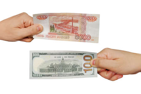 Hands exchange rubles for dollars.