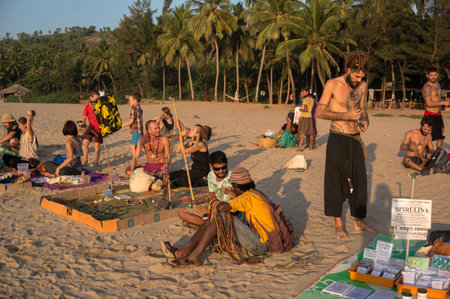 19 January 2017. local hippies sell hand-made goods at a flea market in Gokarna on the beach at sunsetのeditorial素材