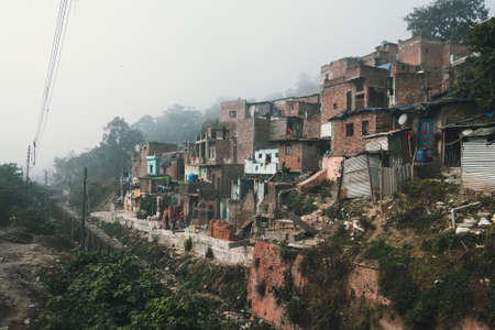 old dirty houses in the slums quarter in Haridwar, India. Poverty and hunger as a social problem of our timeの写真素材