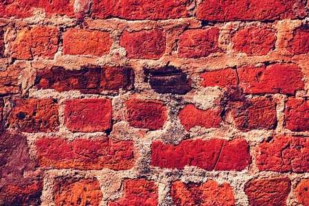 Red old worn brick wall texture background. Vintage effect. close upの写真素材