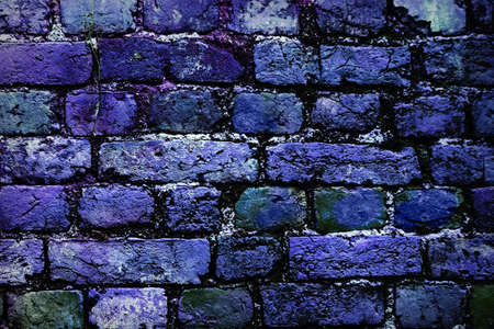 deep blue brick wall background faded on black. Brick wall painted in bright colors. Blue bricks in the wall.の写真素材