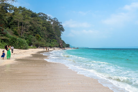 Indian tourists take pictures of the sea on the beach of Havelock island Andaman Nicobar Islands. India. 18 January 2018のeditorial素材