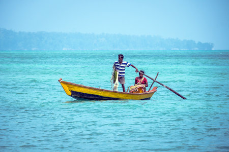 HAVELOCK ISLAND, ANDAMAN AND NICOBAR, INDIA 18 January 2018 : Local fishermen with boat in sea. the...