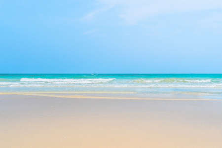 Idyllic perfect tropical white sandy beach and turquoise clear ocean water - summer vacation natural background with blue sunny skyの写真素材