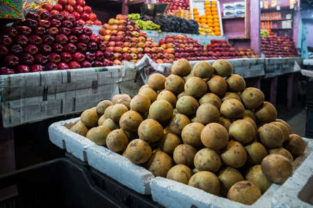 Ripe fruit on the street counter at the fruit market in India. Typical Asian fruit market.の写真素材
