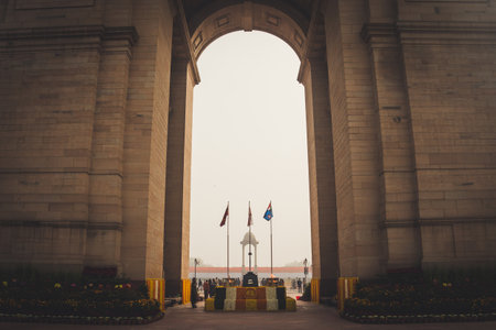 New Delhi, India, January 27, 2018 : Canopy and India Gate. Air Force, Indian Navy and Indian Army Flags Waving at India gate. The Indian gate is the national monument of India. Republic day.のeditorial素材