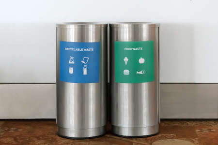 Two types of waste separation tanks. Hazardous waste. Dry garbage. wet waste. metal trash cans at the airportの写真素材