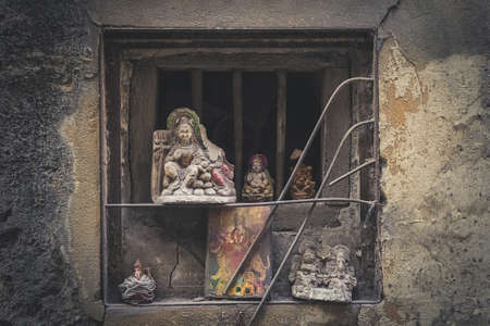 Old statues of Indian gods in the window opening of the sacred temple. Ganesh Shivaの写真素材