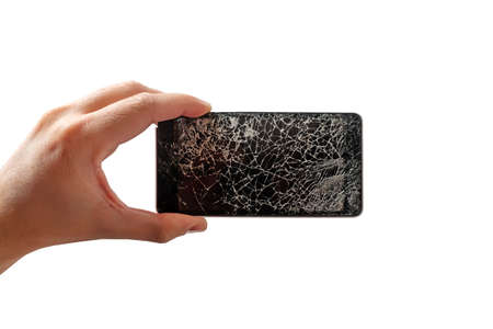 Hand with modern touch screen smart phone and broken screen isolatedの写真素材
