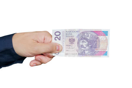 20 zloty bill of Poland, violet picture in a man's hand. Isolated object on white background. Hand giving banknotes in financial, money exchange and donation concepts.の写真素材