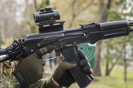 man aiming with an AK-47 with reflex sight, separatist.