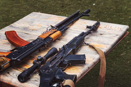 Arms trafficking. different rifles on the counter in the gun shop.