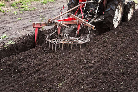Farmer preparing land for sowing.の写真素材