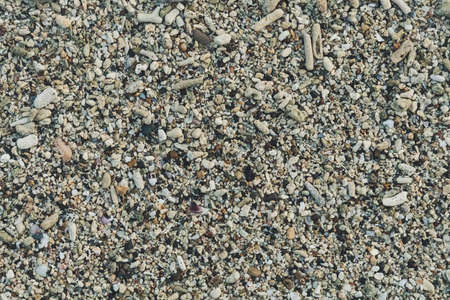 sea pebbles pebbles colored granite on the beach on the beach background Sea shells, corals, pebble stones and sand for background.の写真素材
