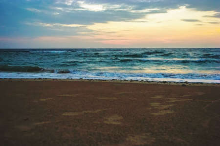 Early Morning Sunrise on Waimanalo Beach on Oahu, Hawaii bursting through the clouds.の写真素材
