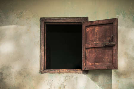 Open old window on the old house.