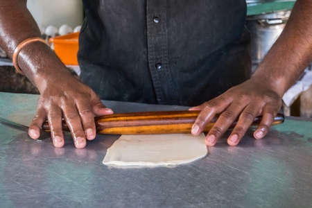 Cooking dough for baking in the kitchen, ready-made pies for baking, chef's hands prepare dough for...