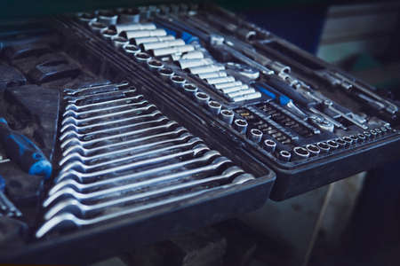 Tool box. Toolset with interior compartments to keep wrenches, ring spanners, hammer, pliers, screwdrivers, monkey wrenches, screws boltsの写真素材